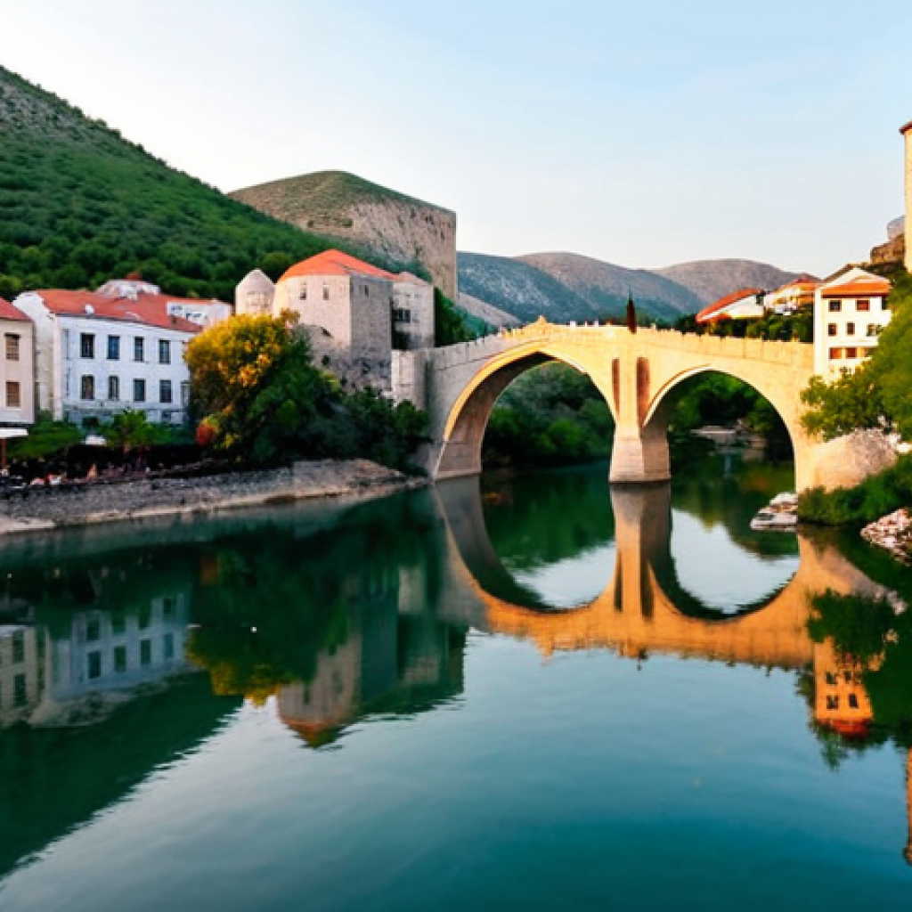 보스니아에서 배낭여행하기 좋은 숙소 추천 - **Mostar: Enchanting Sunset over the Old Bridge**
A breathtaking, wide-angle shot of Mostar's St...